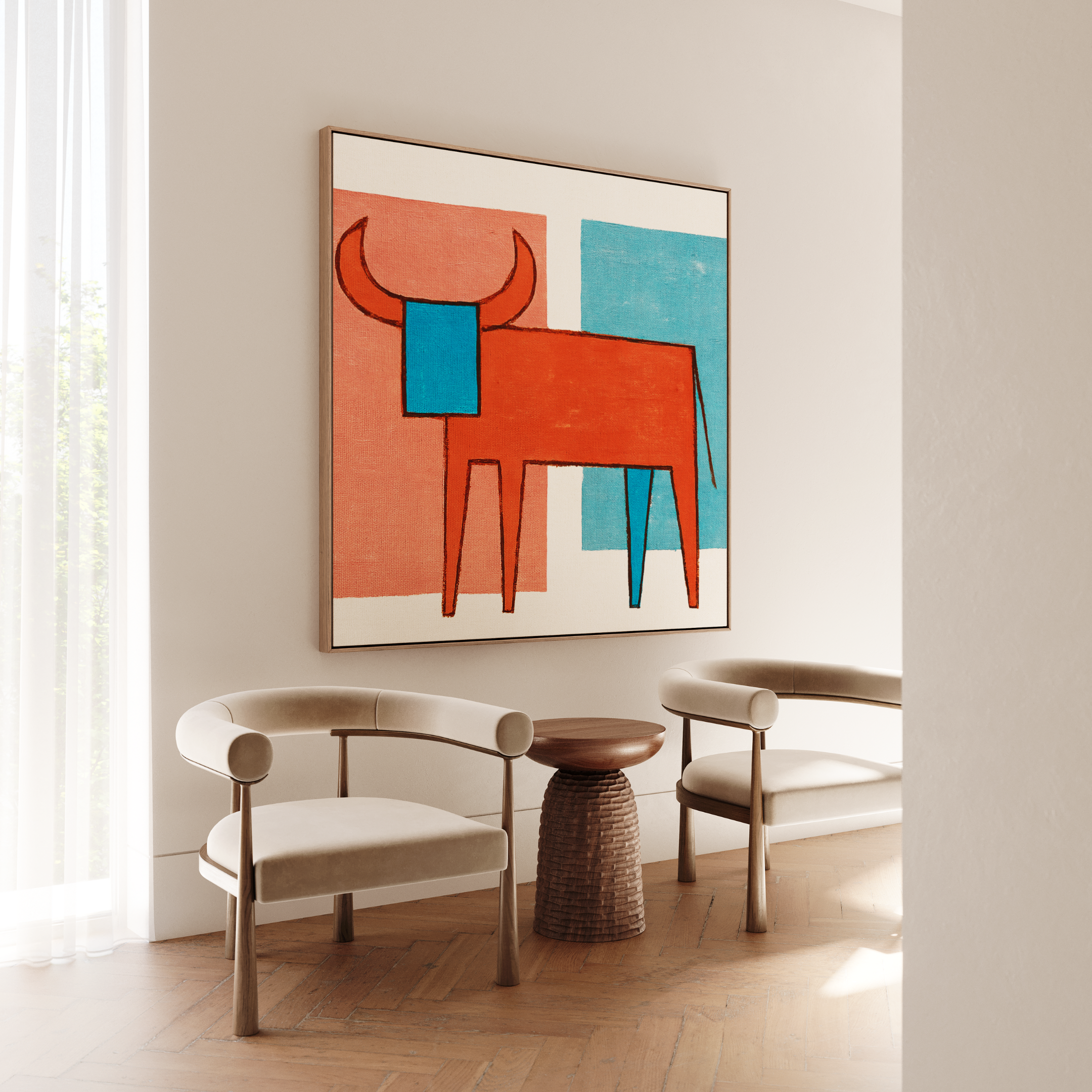Abstract bull painting in red and blue, with beige curved chairs and a textured side table. - Vybe Interior